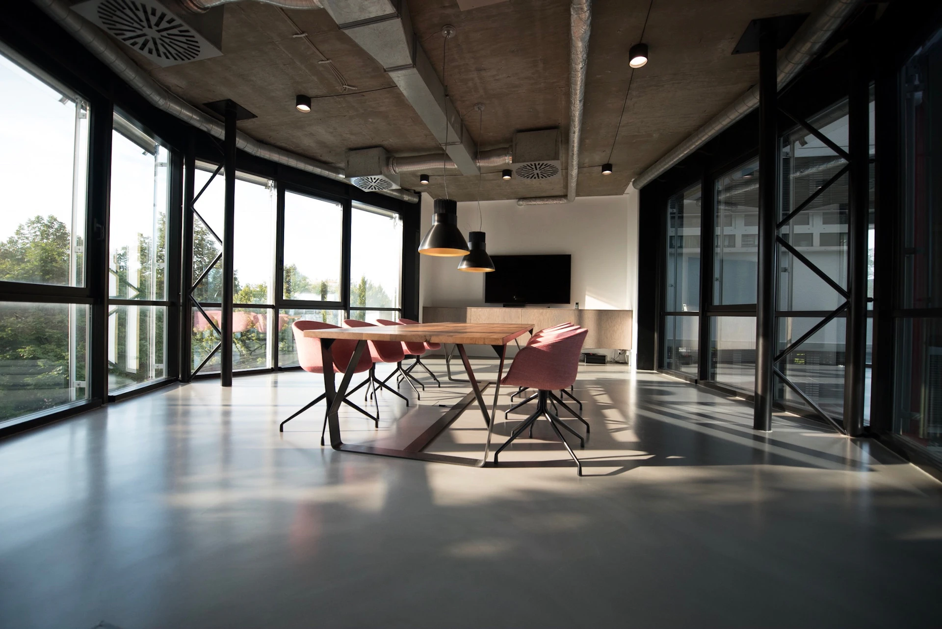 A bright office with shared desks and meeting spaces